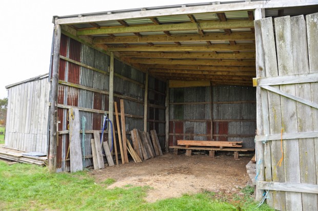 The barn with a handy selection of milled wood, old and new; sleepers, framing, beams, and slabs.